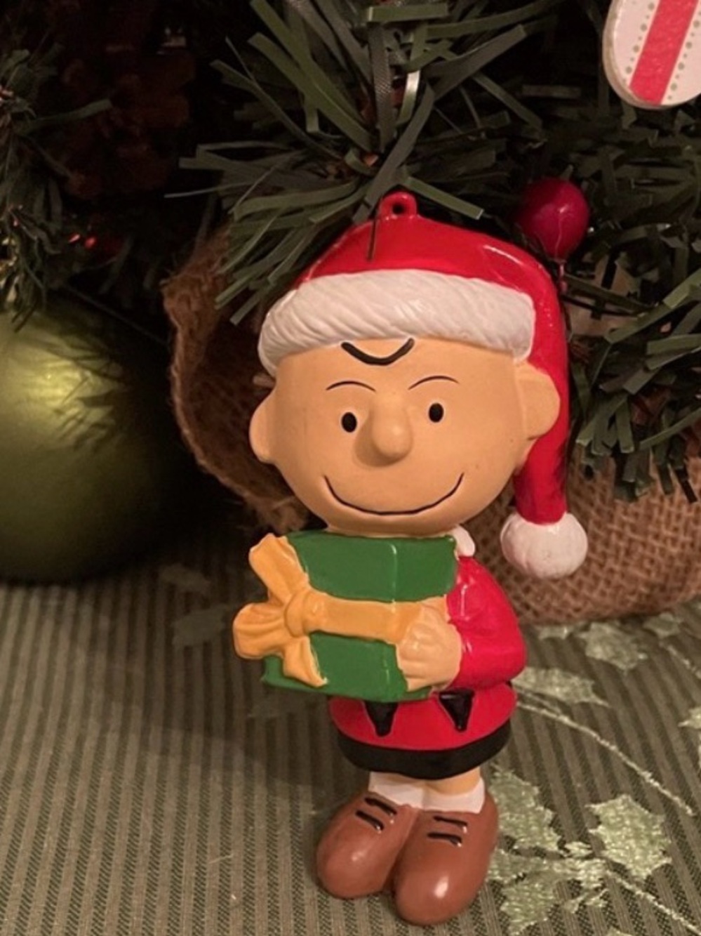 Vintage Kurt Adler/UFS Peanuts Charlie Brown Christmas Ornament. Santa suit/gift